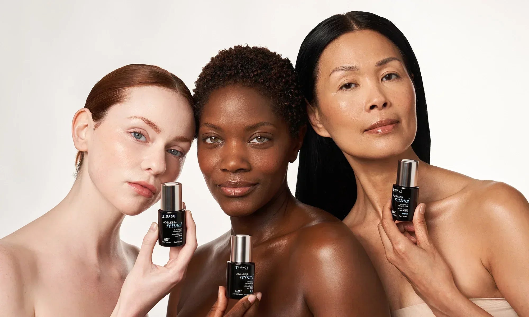 3 models each holding up AGELESS+ retinol pure liquid retinols